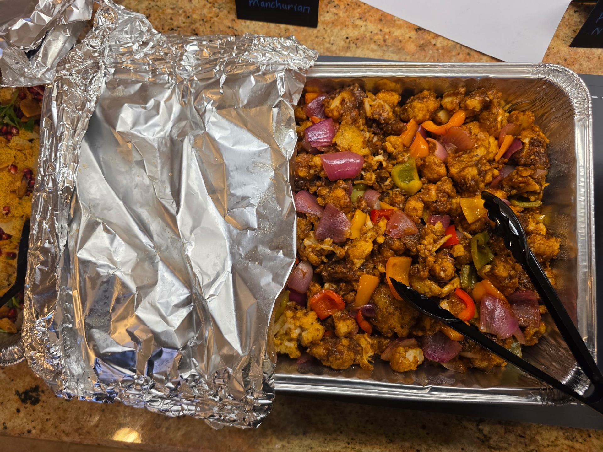 Gobhi Manchurian with onions and bell peppers
