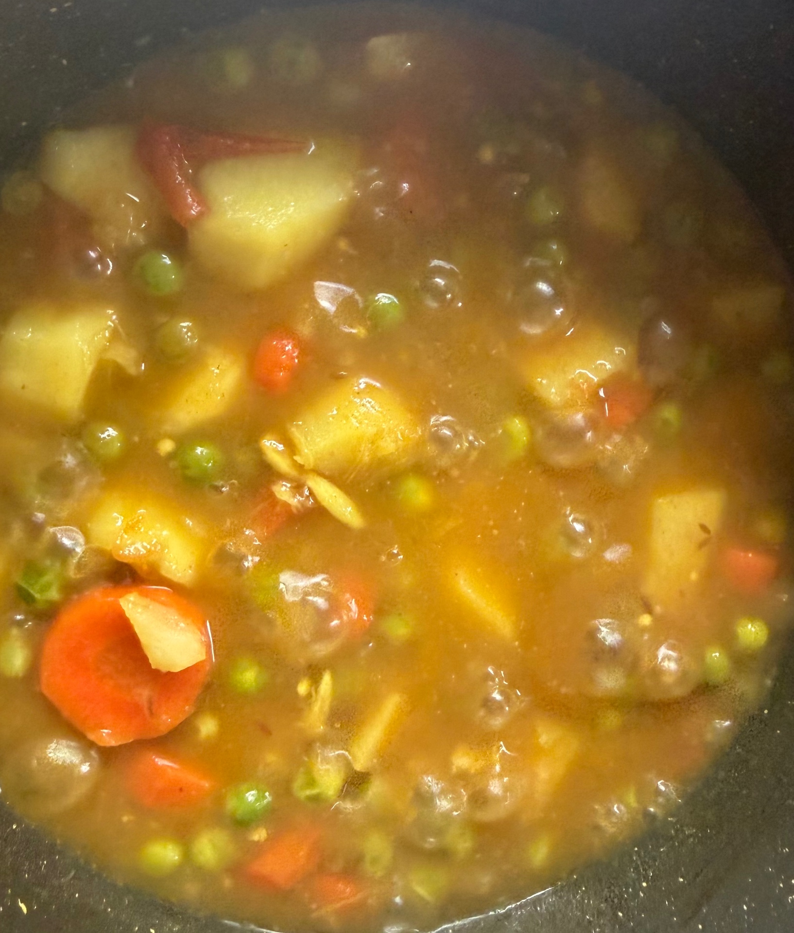 Potato and green peas curry with carrots