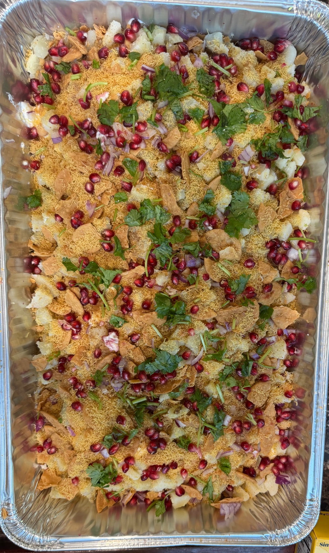 Papdi chaat with potatoes, pomegranate, and sev
