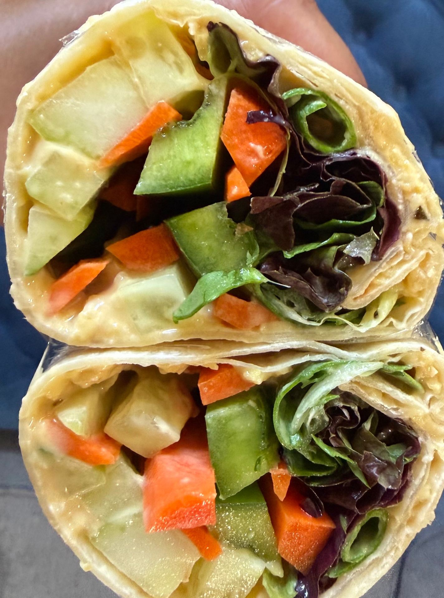 Fresh veggie wrap with carrots and greens