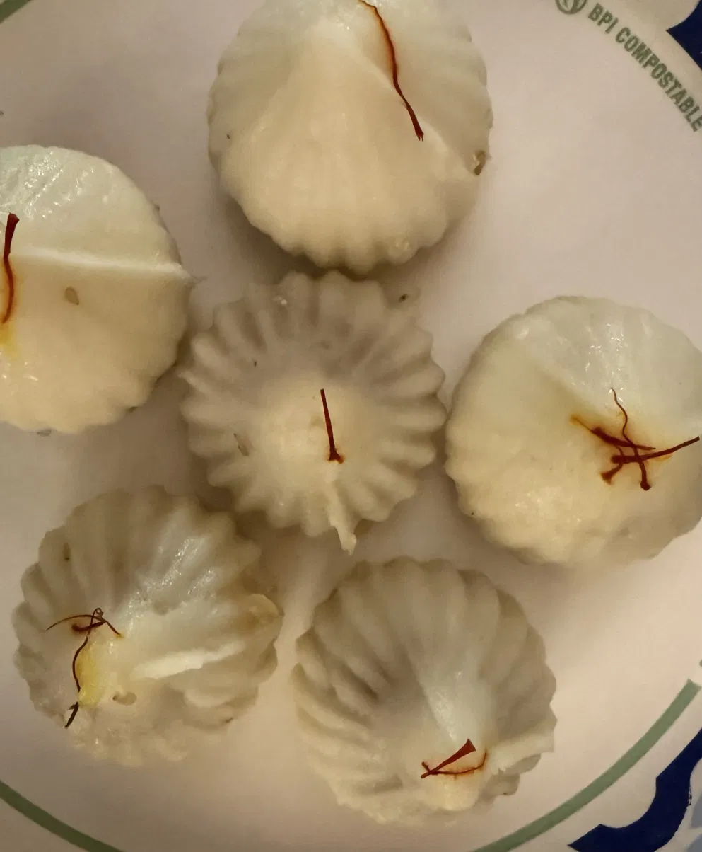 Homemade modak garnished with saffron